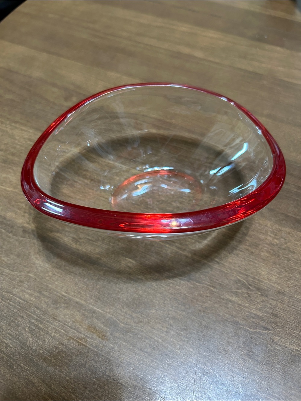 Thick glass with red trim. Google says it is Walther Glass made in Germany.